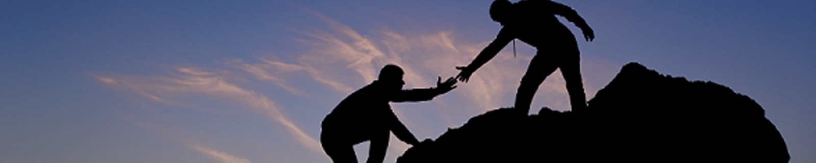 One climber helping another